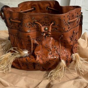 Patricia Nash Burnt Orange Leather Drawstring Bucket Bag with Feather Tassels
